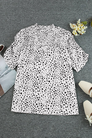 White dalmatian print blouse with shirred yoke and short sleeves