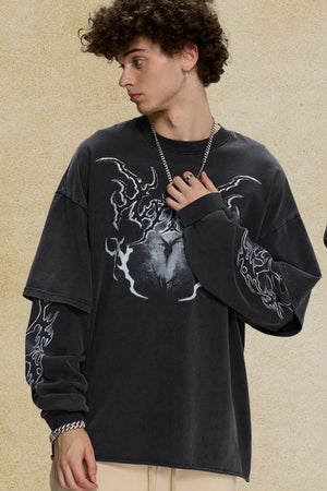 Black layered graphic sweatshirt with distressed details and bold front and sleeve prints.