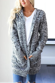 Hooded heathered knit open cardigan in black with pockets and a relaxed fit.
