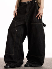 Belted black denim wide-leg jeans with multiple pockets and contrast stitching.