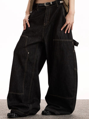 Belted black denim wide-leg jeans with multiple pockets and contrast stitching.