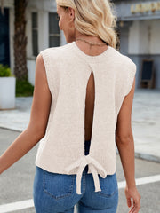 Eggshell knit vest with open back and bow detail, crew neck, sleeveless, casual style
