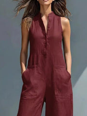 Wine red button-down sleeveless romper with pockets and collared neckline.