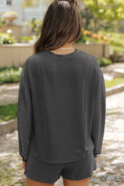 Black ribbed knit matching set with crew neck top and shorts