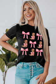 Black t-shirt with a graphic print of brown cowboy boots with pink bows.