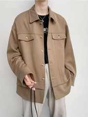 Oversized khaki button-down jacket with chest pockets and a relaxed fit.
