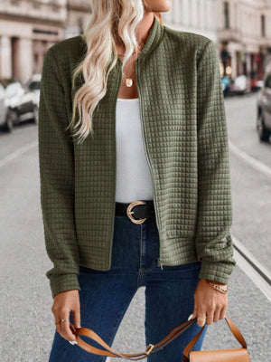 Army green quilted bomber jacket with zip closure and ribbed collar.