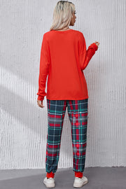 Red long sleeve top and plaid lounge pants with green, red, and white checks.