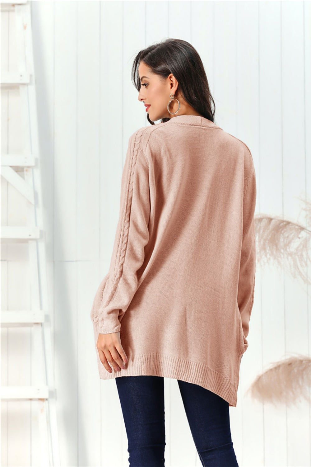 Apricot cable knit open front cardigan with braided sleeve detail