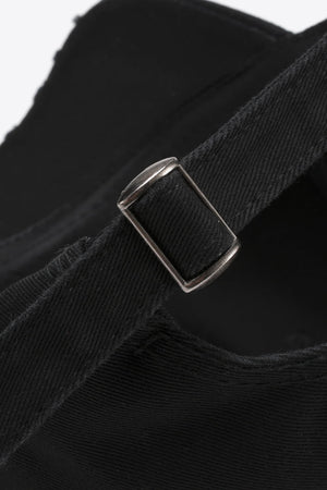 Black baseball cap with adjustable strap and metal buckle detail