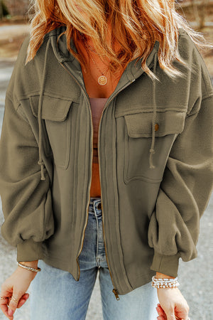 Textured utility hoodie jacket in Tan with drawstring hood, zip front, and chest pockets.