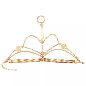 Gold multi-layered chain bracelet with coin details and a ring accent.