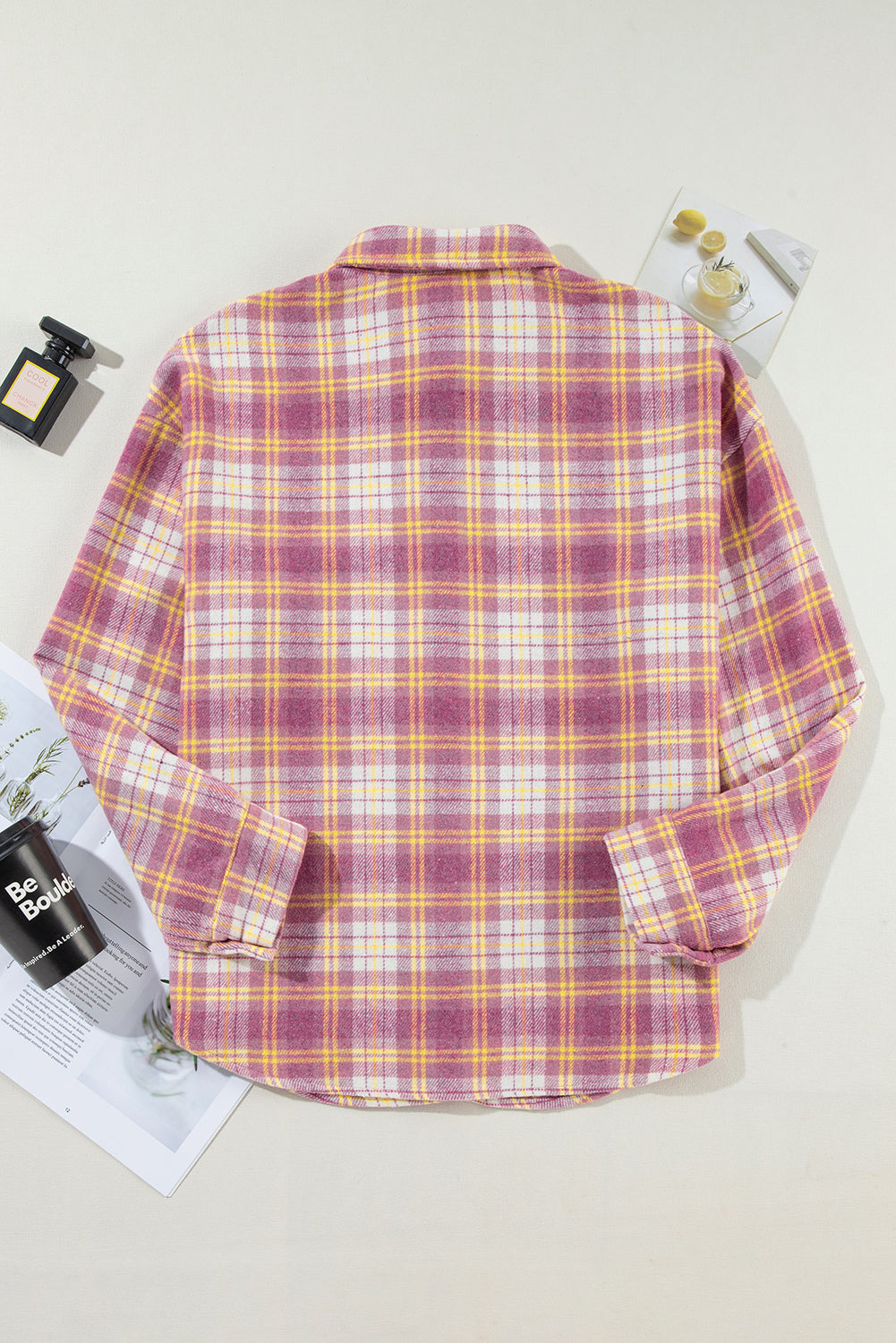 Oversized pink plaid button-down flannel shirt with a classic collar and long sleeves.