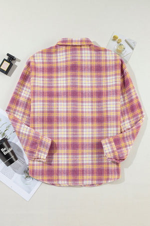 Oversized pink plaid button-down flannel shirt with a classic collar and long sleeves.