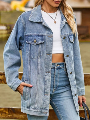 Relaxed fit washed denim trucker jacket in medium blue with button front and chest pockets.