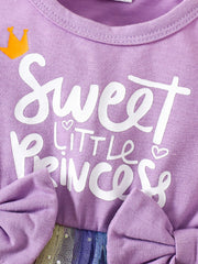 Lavender baby dress with "Sweet Little Princess" graphic, crown detail, and bow accents.