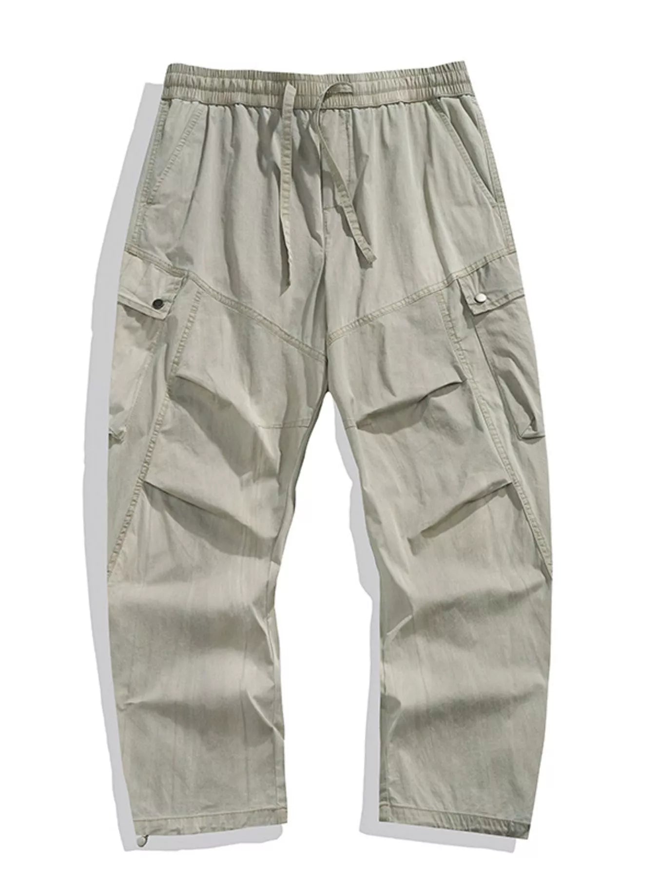 Loose fit khaki cargo pants with drawstring waist and multiple pockets.