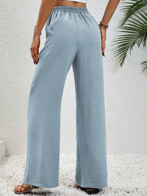Light Blue textured palazzo trousers with drawstring waist and wide legs.