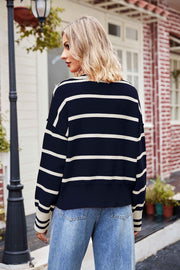 Navy striped knit sweater with polo collar and cream stripes.