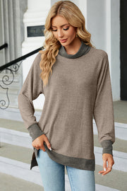 Colorblock raglan turtleneck tunic in mocha with dark gray accents, featuring a relaxed fit and high-low hem.