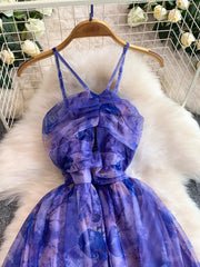 Electric purple floral mesh maxi dress with ruched bodice and tie straps.