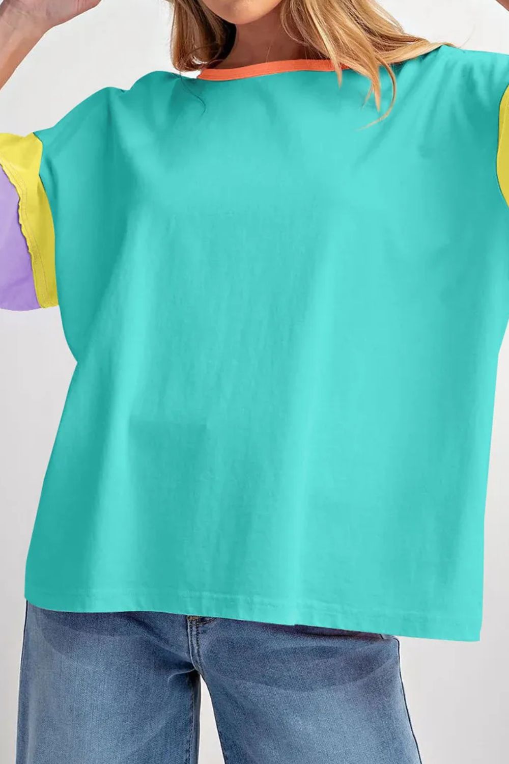 Teal raglan tee with colorblock sleeves in yellow and purple, and an orange neckline.