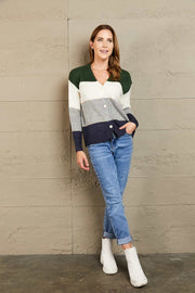 Colorblock acrylic cardigan with button front and metallic trim detail.