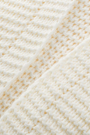 Textured knit cocoon cardigan in cream acrylic with a waffle knit pattern.
