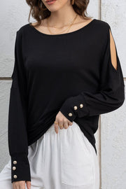 Black shoulder-slit top with button cuffs and a boat neckline.