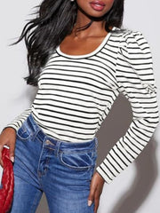 Breton stripe tee with puff sleeves and scoop neck, worn with blue jeans.