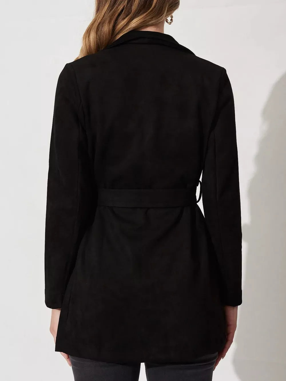 Black suede duster coat with tie waist and lapel collar.