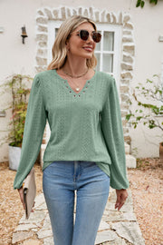 Light green eyelet yoke blouse with blouson sleeves and v-neck detail