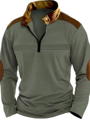 Sage quarter-zip pullover with brown contrast panels and elbow patches.