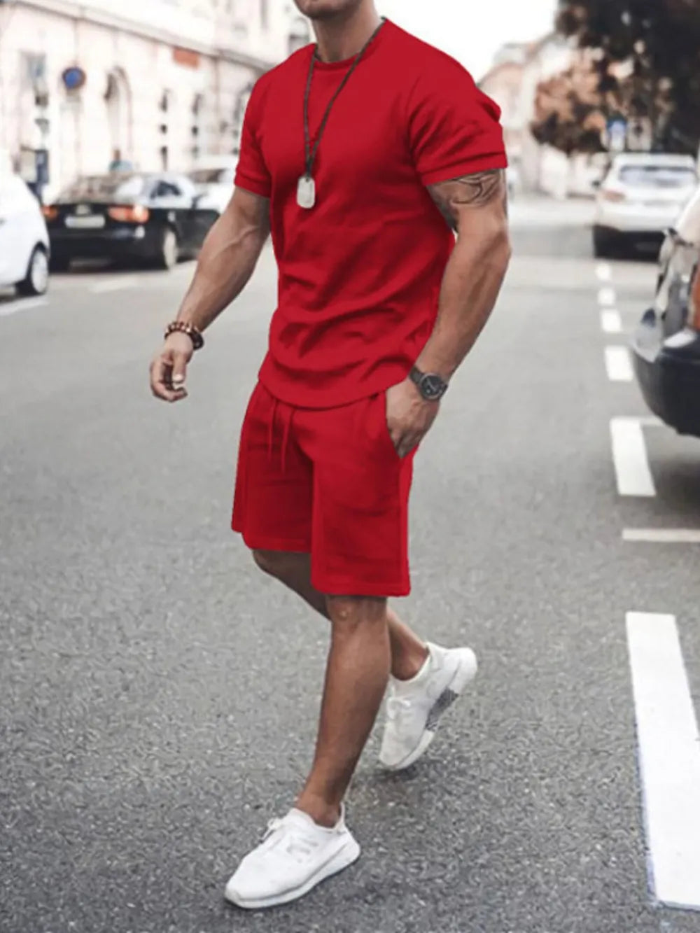 Red men's crew neck t-shirt and drawstring shorts co-ord set.
