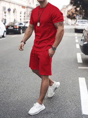 Red men's crew neck t-shirt and drawstring shorts co-ord set.