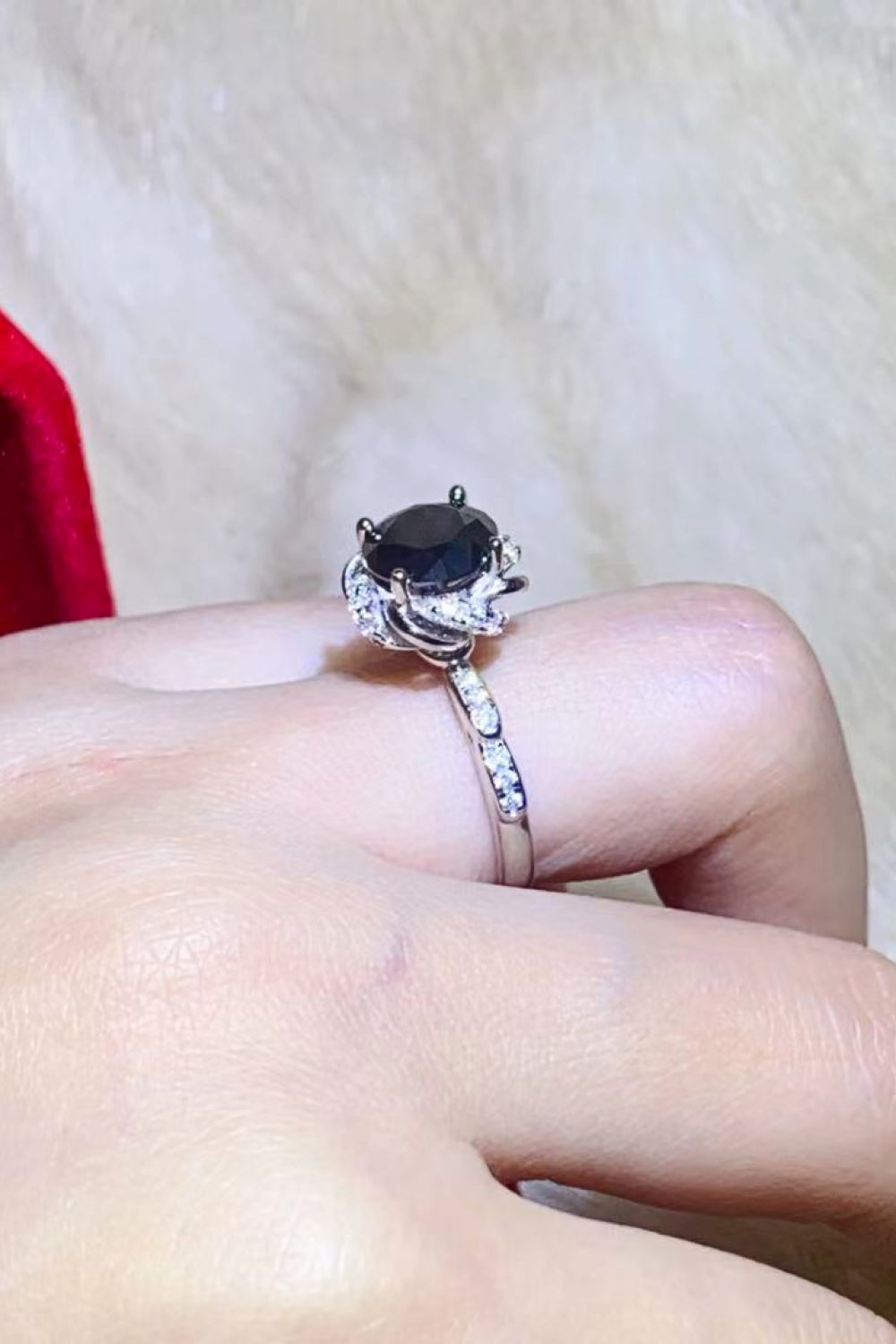 Black moissanite ring with diamond accent band and floral setting