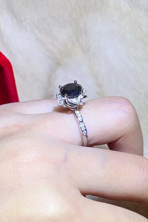 Black moissanite ring with diamond accent band and floral setting