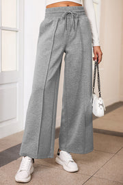 Heather gray palazzo joggers with center seam detail and drawstring waist.