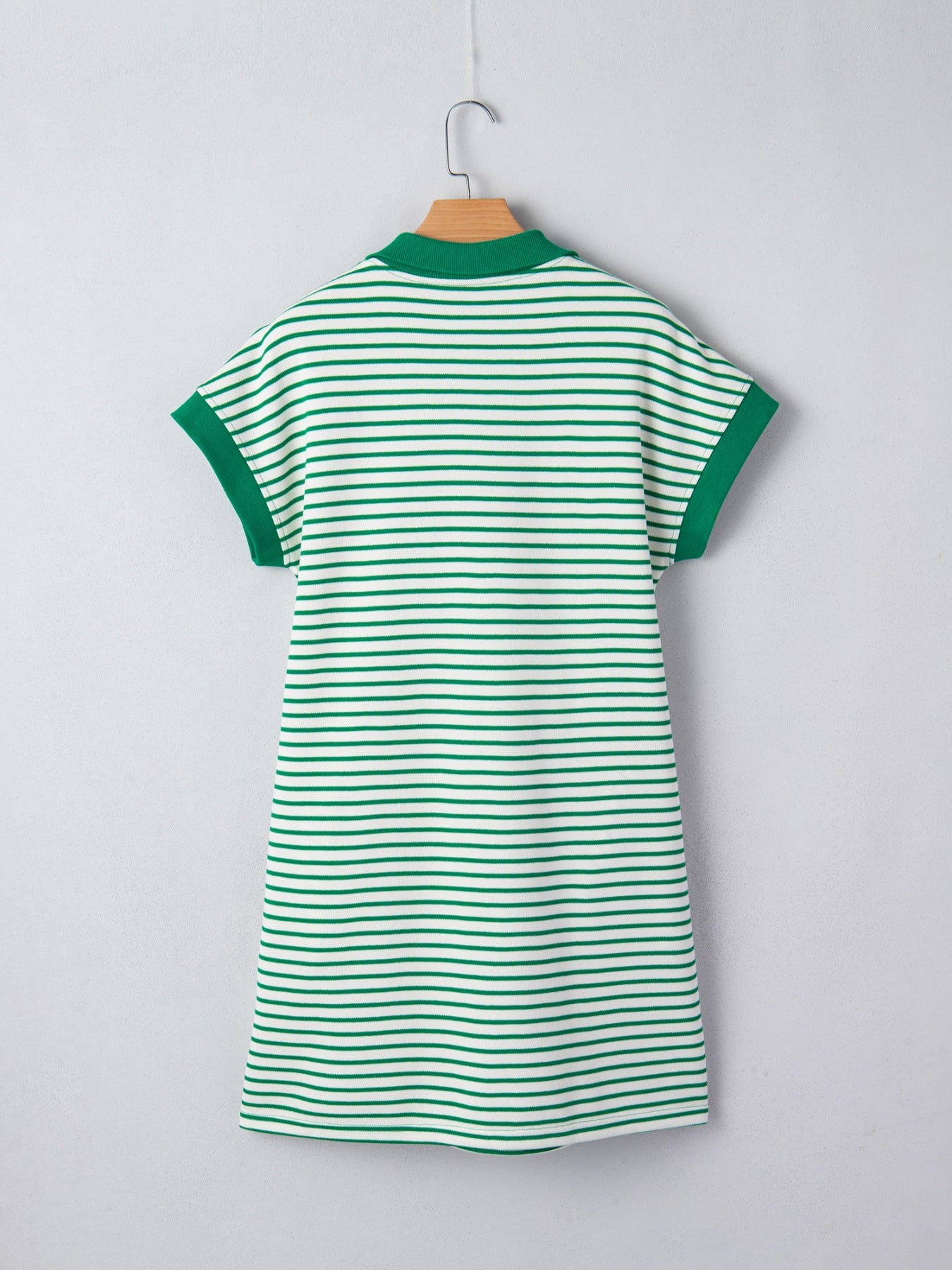 Green and white striped polo collar dress with short sleeves and green trim.
