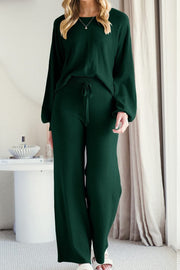 Dark green loungewear set with balloon sleeves and wide-leg pants with drawstring waist.