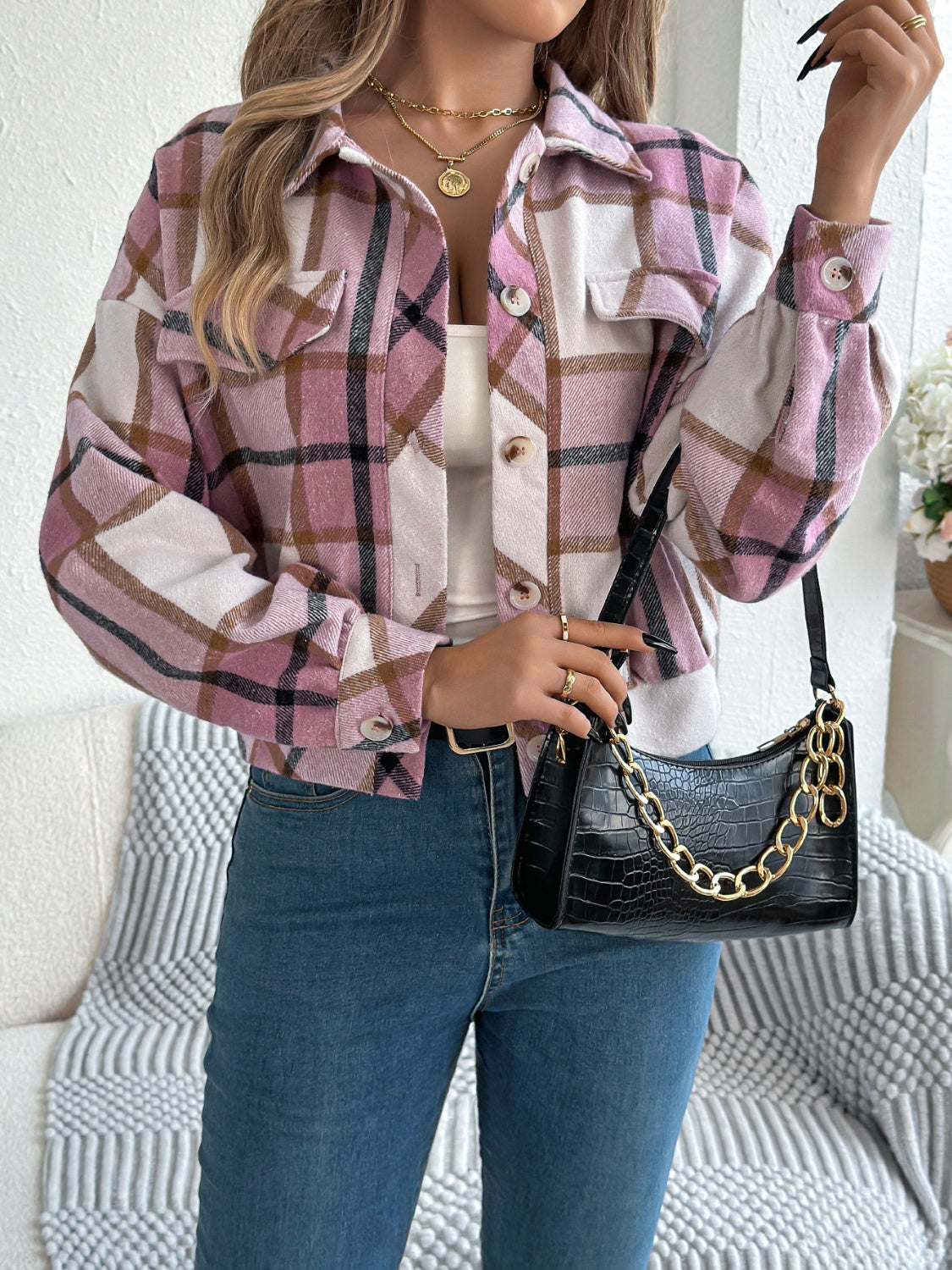 Cropped plaid shacket in dusty pink with gathered sleeves and buttoned pockets.