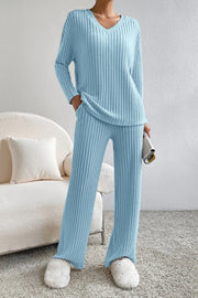 Light blue ribbed knit lounge set with v-neck sweater and wide leg pants.