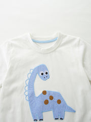 White cotton toddler t-shirt with blue dinosaur applique and brown spots.