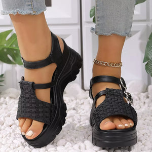 Black woven texture high wedge sandals with adjustable buckle straps and chunky platform sole.