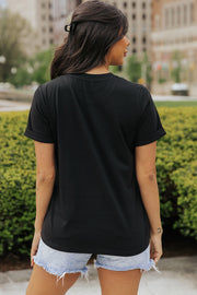 Black t-shirt with cuffed short sleeves and a rounded hem.