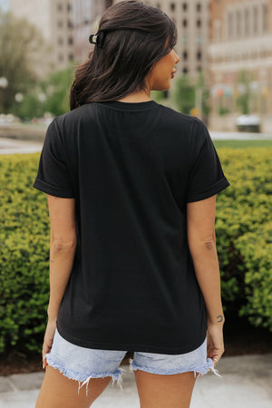 Black t-shirt with cuffed short sleeves and a rounded hem.