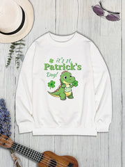 White St. Patrick's Day sweatshirt with a cartoon dinosaur holding a shamrock.
