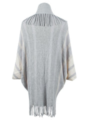Textured fringe capelet in charcoal and ivory stripes with a high neck and fringed hem.
