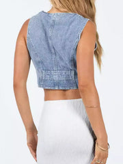 Light blue denim vest with button detail and adjustable waist strap.
