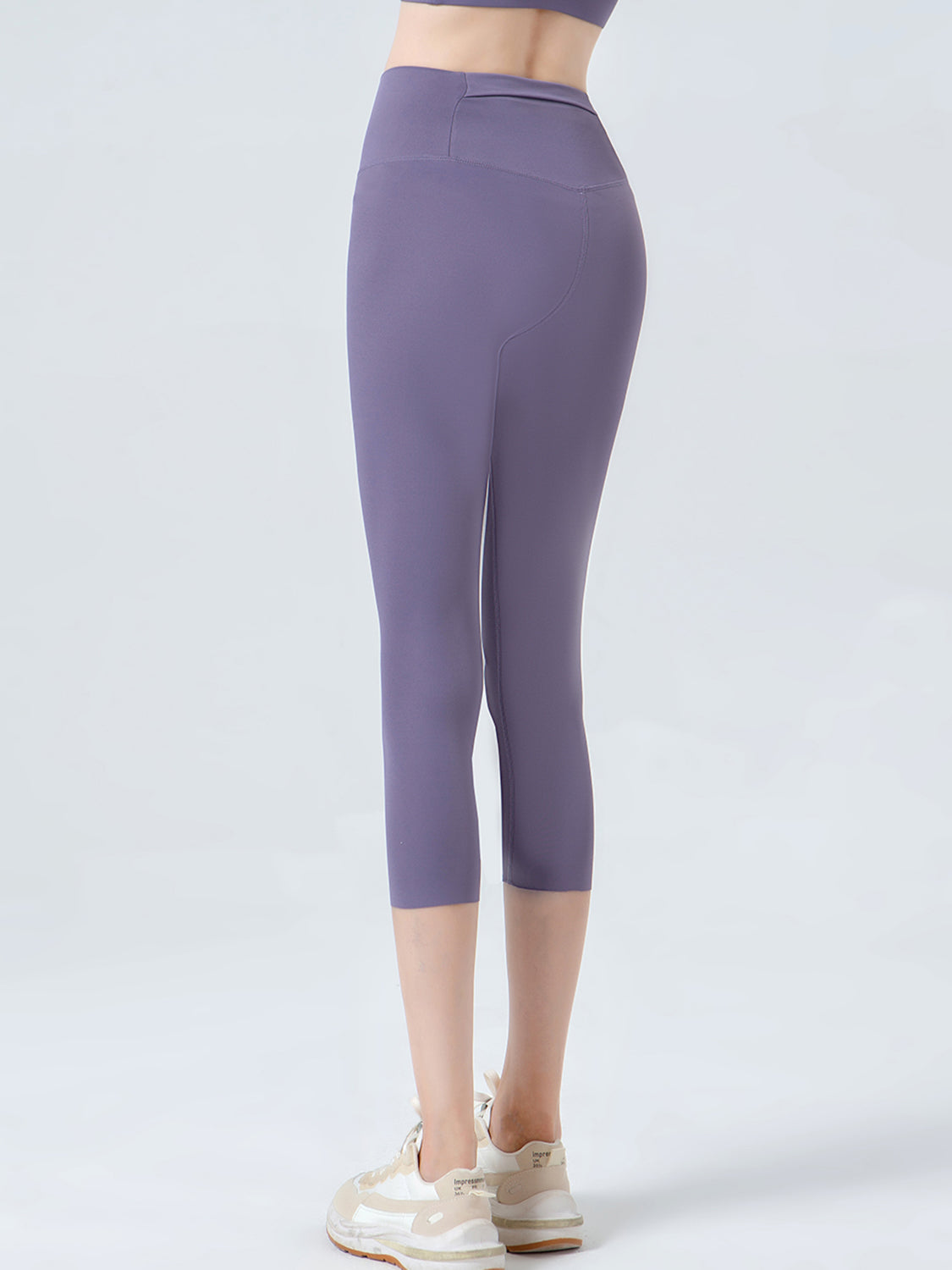 Lavender sculpted crop leggings with a high waistband and subtle contouring details.